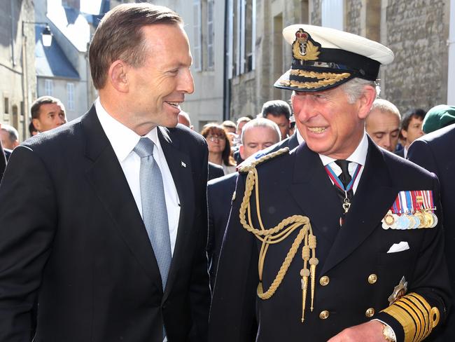 06/06/2014 BAYEUX- Australian Prime Minister Tony Abbott with Charles, Prince of Wales, and British Prime Minister David Cameron in Normandy, France. The three are walking with War Veterans