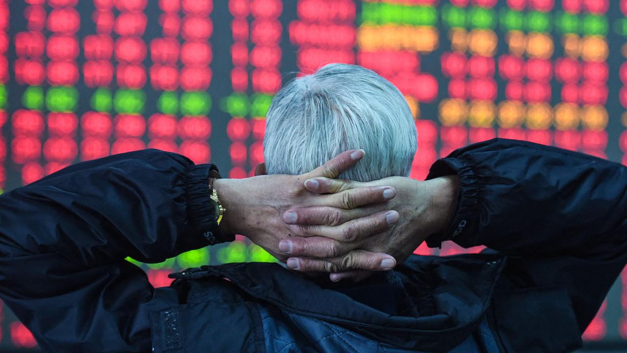 An investor looks at a screen showing stock market movements at a securities company in Hangzhou, in eastern China's Zhejiang province on February 8, 2024. (Photo by AFP) / China Out