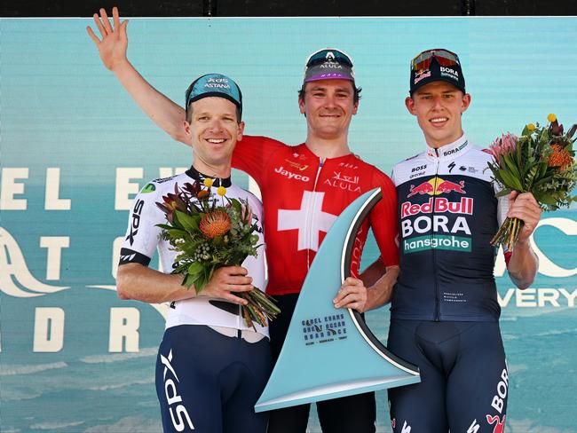 Aaron Gate of New Zealand and XDS Astana Team on second place, race winner Mauro Schmid of Switzerland and Team Jayco AlUla and Laurence Pithie of New Zealand and Team Red Bull - BORA - hansgrohe on third place pose on the podium ceremony. Picture: Dario Belingheri/Getty Images