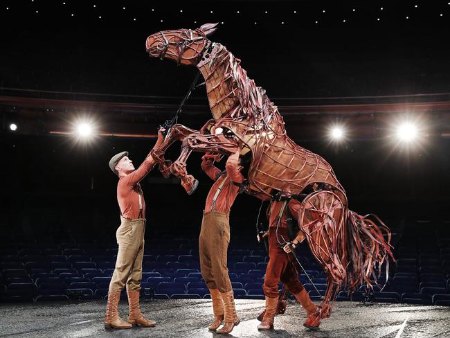 Puppeteers from War Horse work together on stage. Picture: Sam Ruttyn