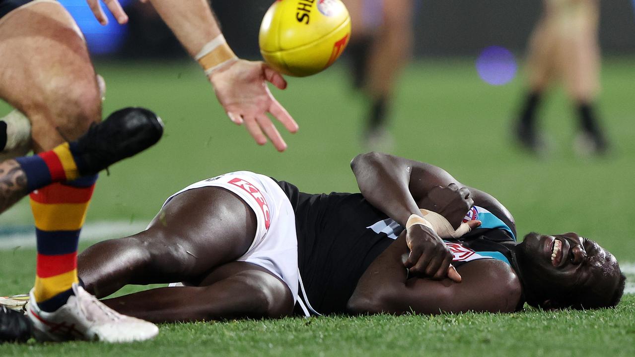 Aliir Aliir played on after being concussed. Picture: Sarah Reed/AFL Photos via Getty Images