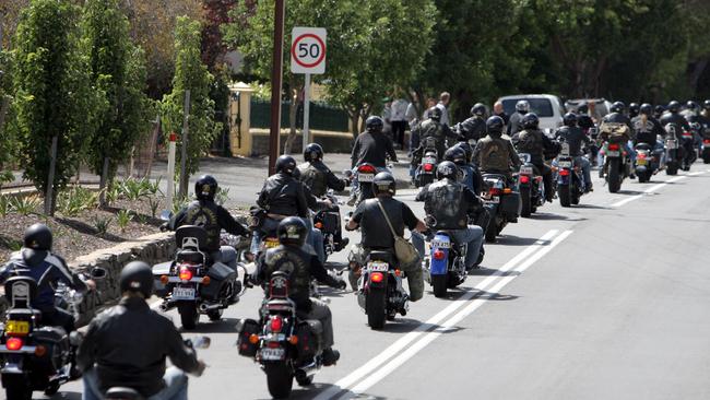 Rival motor cycle gang members participate in a protest ride against government moves to ban outlaw bikie gangs.