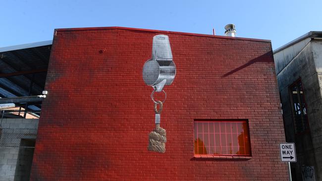 Part of Cam Scale's artwork, "Don't Shoot the Messenger", in Proudfoots Lane at the M|Arts precinct in Murwillumbah, has been painted over.