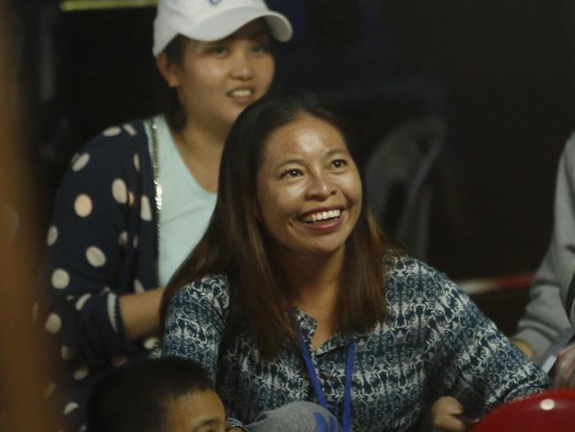 A family member smiles after hearing the news that the missing boys and their soccer coach have been found. Picture: AP