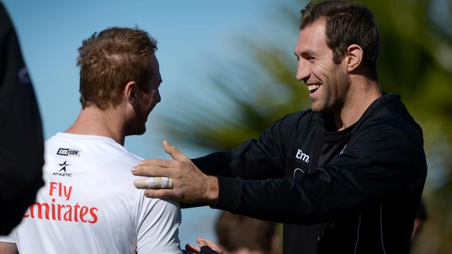 Happier times: Travis Cloke with former teammate Ben Johnson in 2013.