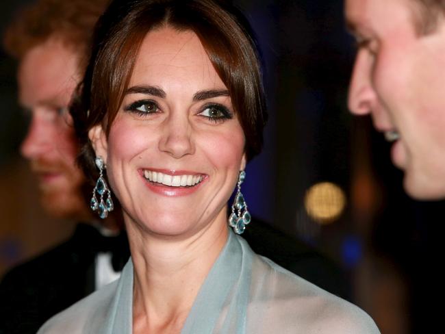 Prince Harry (L), Catherine, Duchess of Cambridge (C) and Prince William, Duke of Cambridge (R) attend The Cinema and Television Benevolent Fund's Royal Film Performance 2015 of the new James Bond 007 film "Spectre" at Royal Albert Hall on October 26, 2015 in London, England.REUTERS/Chris Jackson/Pool