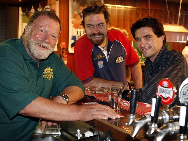 Actor Jack Thompson, left, behind the bar at the Edwardstown Football Club with fellow actors Brendan Cowell and Daniel Frederiksen during production of film Ten Empty in 2006. 