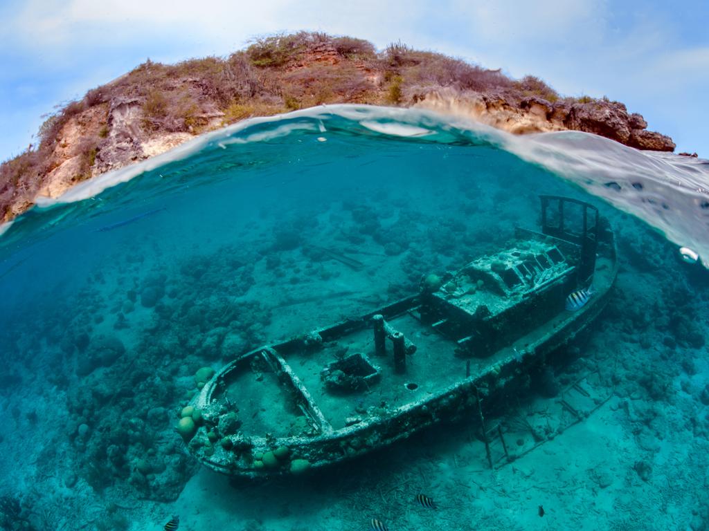 It was too rough for a normal over/under shot. I decided to try a wave  wreck shot with the island of Curacao in the background. All taken while swimming together with my (5 year-old) daughter. Picture: Thomas Heckmann/UPY 2016