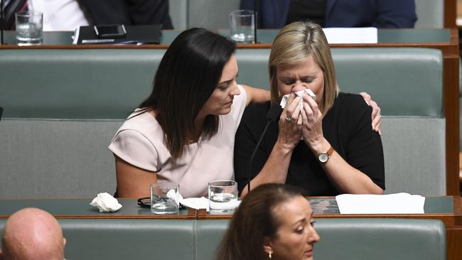 Labor backbench MP Susan Lamb is comforted after making a statement at the end of Question Time. Picture: AAP.