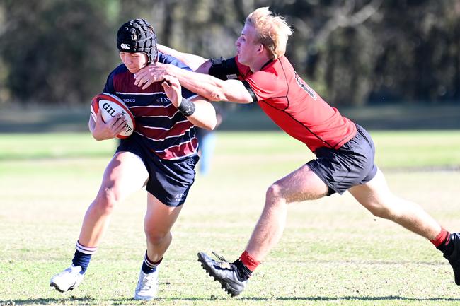 University No.8 Angus Kelly (right) tackles Mason King (left) during the 2023 GPS rugby season. Picture: John Gass
