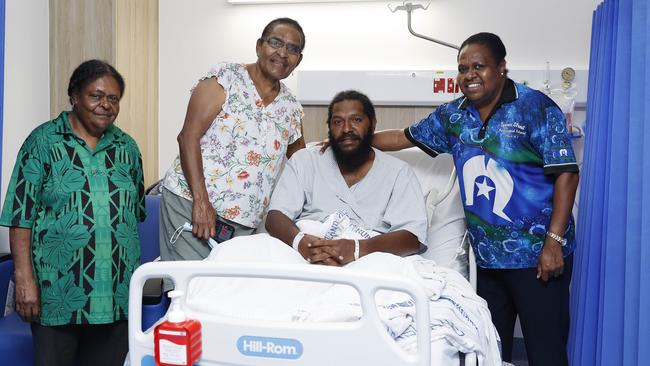 Torres Strait Islander Adea Tabuai was travelling alone in his dinghy in rough seas between Moa and Warraber Islands on Wednesday when his boat capsized. He floated on a small piece of plywood for 24 hours before being rescued on Wednesday by helicopter and flown to Thursday Island Hospital to recover. Adea Tabuai, 31, with his grandmother May Morseu, 67, aunty Nancy Nakata, 65, and cousin Ella Gibuma, 45. Picture: Brendan Radke