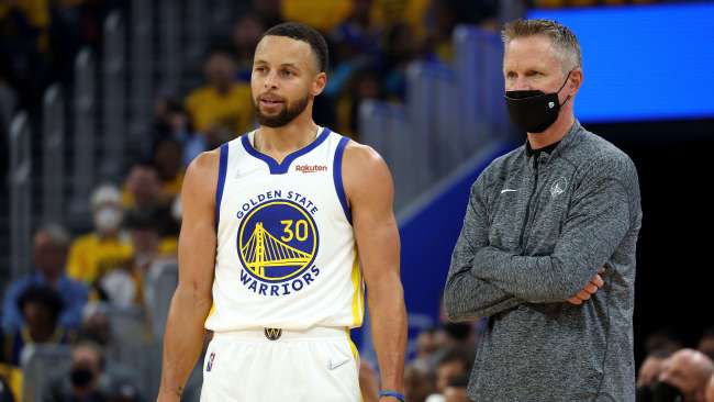 Golden State Warriors coach Steve Kerr has blown up at US Senators for not passing legislation to increase security checks when buying guns. He stands alongside NBA star Stephen Curry. Picture: Harry How/Getty Images/AFP
