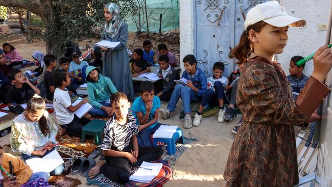 Displaced children attend a makeshift school in Khan Yunis. Picture: Bashar Taleb/AFP