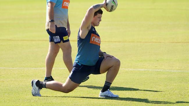 Gold Coast Titans forward Jarrod Wallace stretches inside a fenced-off training ground at the club as players prepare to return to team training on Wednesday Picture: AAP