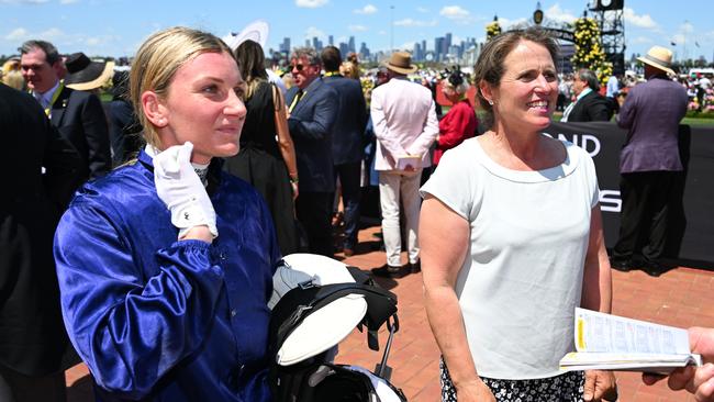 Jamie Kah and trainer Oopy MacGillivray after riding The Map to win Race 5, The Macca's Run, during the 2023 Melbourne Cup. Picture. Vince Caligiuri/Getty Images