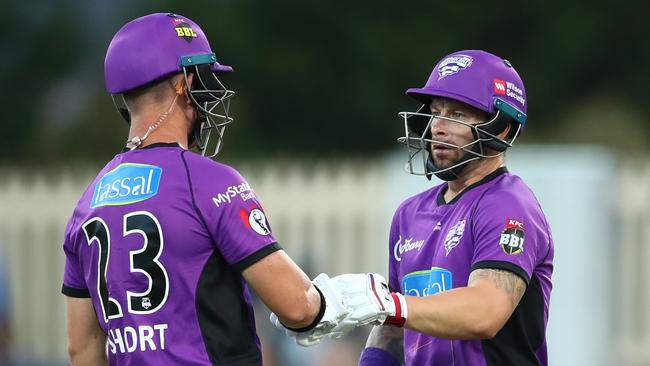 Matthew Wade and D'Arcy Short of the Hurricanes celebrate after Wade reached his 50 during the Hurricanes v Renegades Big Bash League Match at Blundstone Arena. Picture: GETTY