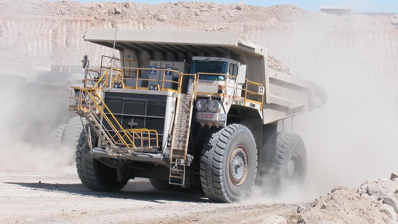 A dump truck goes about its work at a mine site. Generic image.