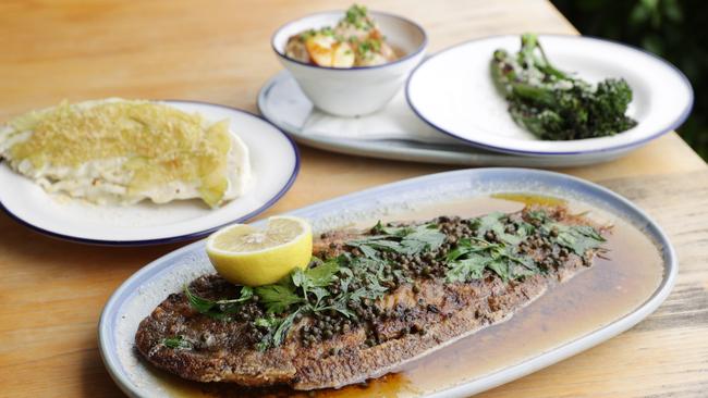 The Signature Sole Meuniere dish with grilled broccolini, sugar-loaf wedge salad and crispy kipfler potato sides at Sole restaurant. Picture: Lachie Millard