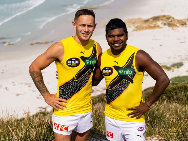 Richmond player Rhyan Mansell and teammate Maurice Rioli model the Dreamtime guernsey Mansell and his family created. Picture: Lucy Edwards/Richmond Media