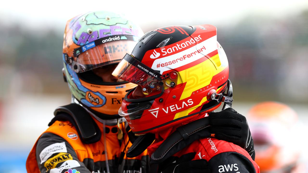 Daniel Ricciardo congratulates winner Carlos Sainz. (Photo by Mark Thompson/Getty Images)