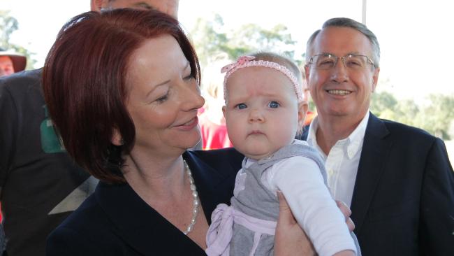 Julia Gillard kisses babies as she begins her first full day of ...