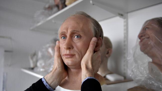 A staff member of the Grevin museum packs a wax statue of Russian President Vladimir Putin before it is stored in the reserve, as a reaction to Russia's invasion of Ukraine on March 1 at the Grevin museum in Paris.