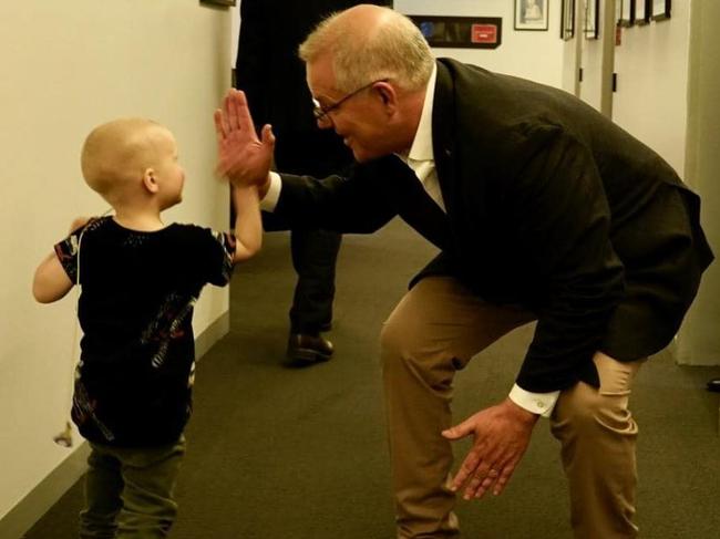 The Prime Minister was seen giving a young child a high-five in one of the pictures.