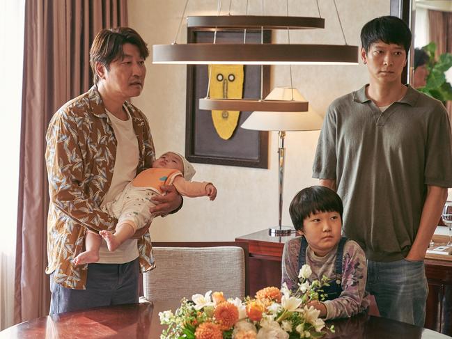 A scene from Broker, from left, Song Kang-ho with baby Park Ji-yong, Im Seung-soo and Gang Dong-won