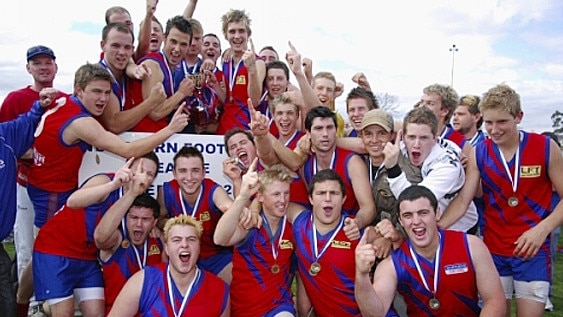 Mernda players celebrate their under-19 premiership win.