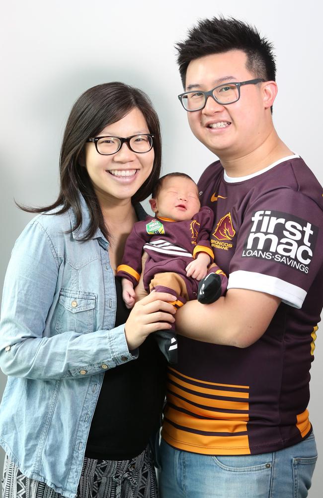 SuperCoach winner Wilfred Zee with new born son Noah and wife Janice. Picture: Jono Searle