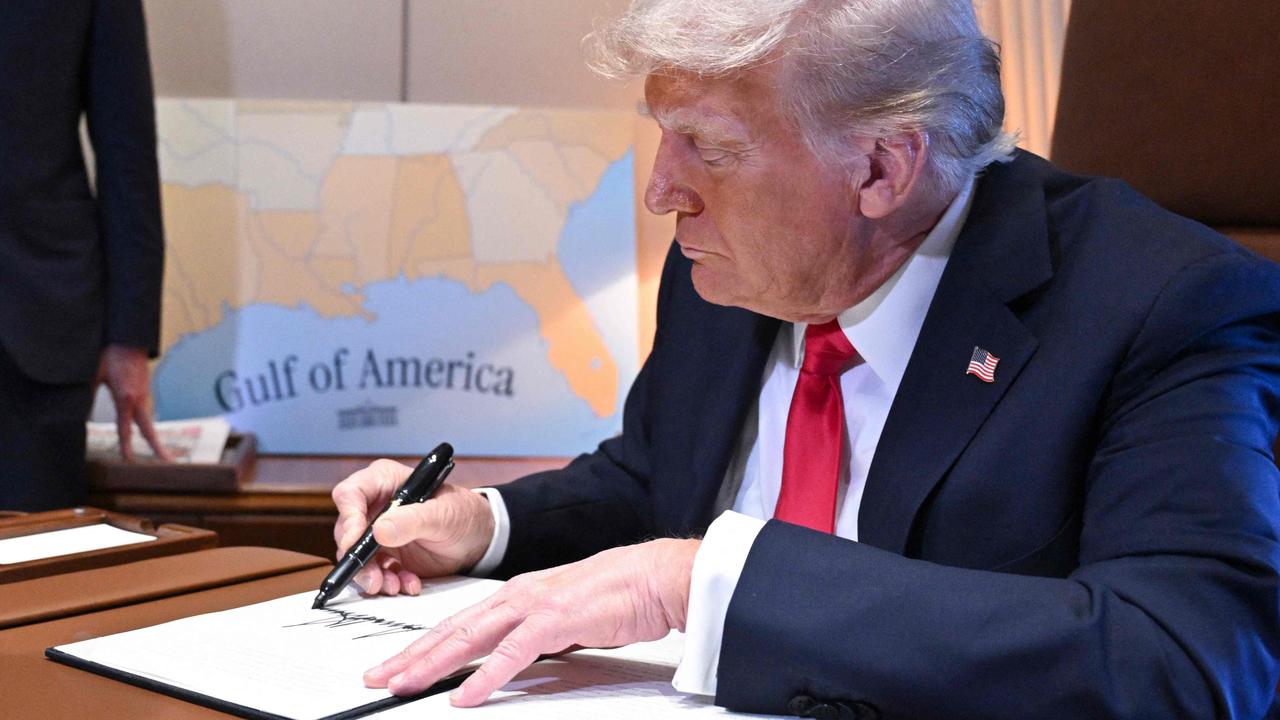 Mr Trump on Air Force One yesterday, signing an executive order making February 9 “Gulf of America Day”, to commemorate his unilateral renaming of the gulf. It was during this event that he revealed the new tariff plan. Picture: Roberto Schmidt/AFP