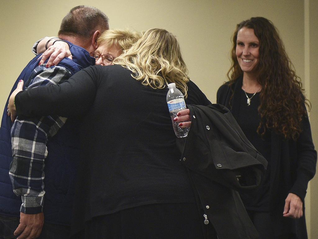 Lynette Johnson, widow of the prison officer Berget beat to death, hugs family with daughter Toni Schafter, right, after the execution. Picture: Briana Sanchez.