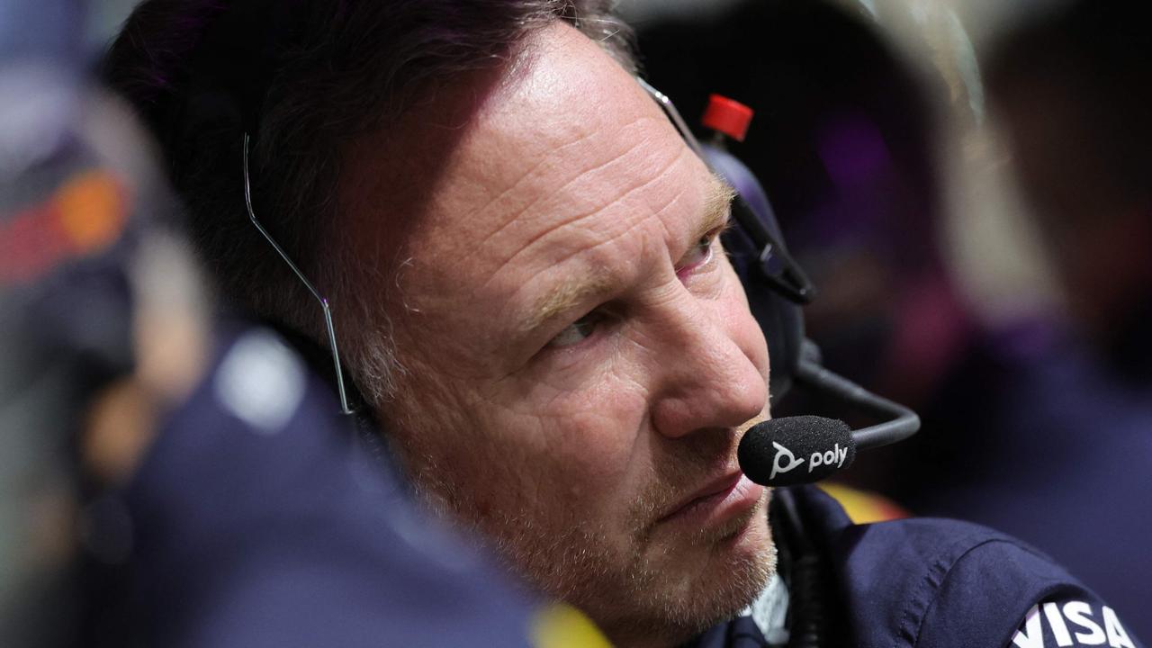 Red Bull Racing team principal Christian Horner monitors from the pit wall during the qualifying session of the Saudi Arabian Formula One Grand Prix at the Jeddah Corniche Circuit in Jeddah on March 8, 2024. (Photo by Giuseppe CACACE / POOL / AFP)