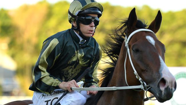 Jockey Tim Clark returns to the mounting yard after riding Snitz to victory in race 8, the DeBortoli Wines Takeover Target Stakes, during Gosford Cup Day at Royal Randwick Racecourse in Sydney, Saturday, May 9, 2020. (AAP Image/Dan Himbrechts) NO ARCHIVING, EDITORIAL USE ONLY