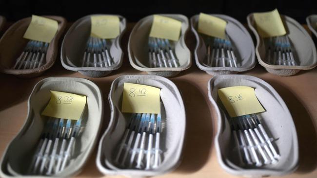 Trays with syringes filled with the AstraZeneca vaccine lay ready for use at the St Antonius Church in Castrop-Rauxel, western Germany.