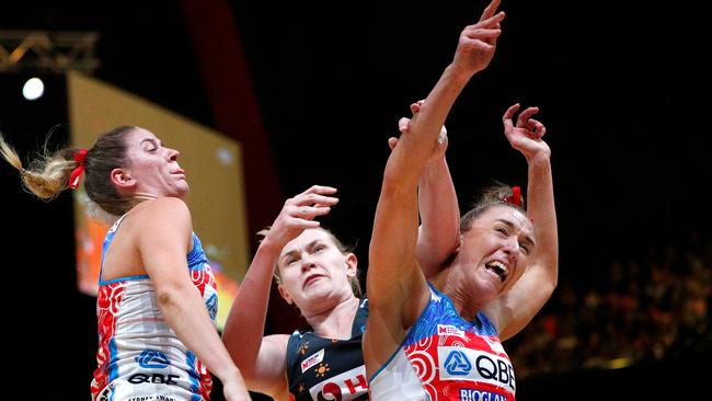 Kristina Brice of the Giants (centre) collides with Sarah Klau of the Swifts (right) during local derby.