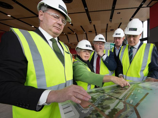 Nationals senator Steve Martin, left, actin Devonport mayor Annette Rockliff, Braddon Liberal candidate Brett Whiteley, Liberal senator Richard Colbeck and deputy Prime Minister Michael McCormack studying the Living City plans. Picture: GRANT WELLS