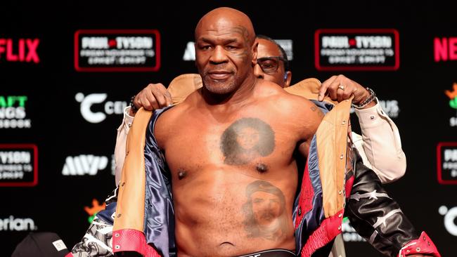 Mike Tyson steps on the scales before fighting Jake Paul. Photo by Brett Carlsen/Getty Images for Netflix.