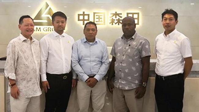 Peter Shanel Agovaka, centre, and Anthony Veke, second from right, meet China Sam Group executives in Beijing.