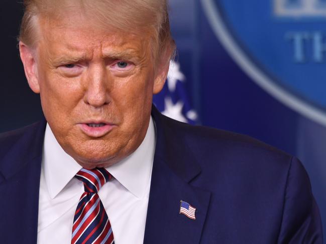 US President Donald Trump answers questions during a news conference in the Brady Briefing Room of the White House in Washington, DC, on August 12, 2020. (Photo by Nicholas Kamm / AFP)