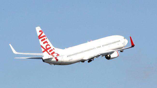 A Virgin Australia plane takes to the sky over Gold Coast Airport before the global COVID-19 pandemic.