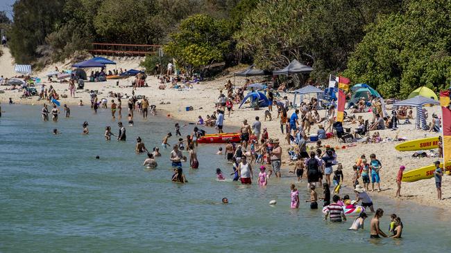 Beachgoers enjoying the public holiday and hot weather at Tallebudgera Beach. Picture: Jerad Williams