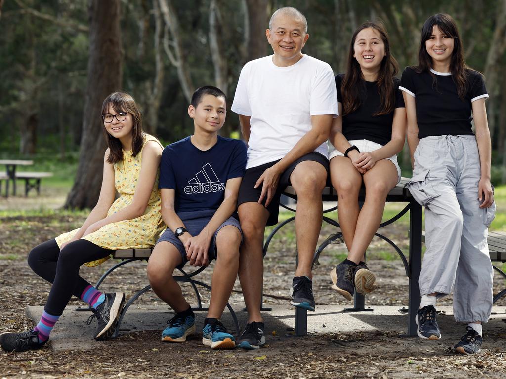 Kevin Goodall, centre, has four children at four different schools, each with its own phone policy. From left is Abbey, 13, Luke, 15 Lana Goodall, 16, and Anna, 14. Picture: Richard Dobson