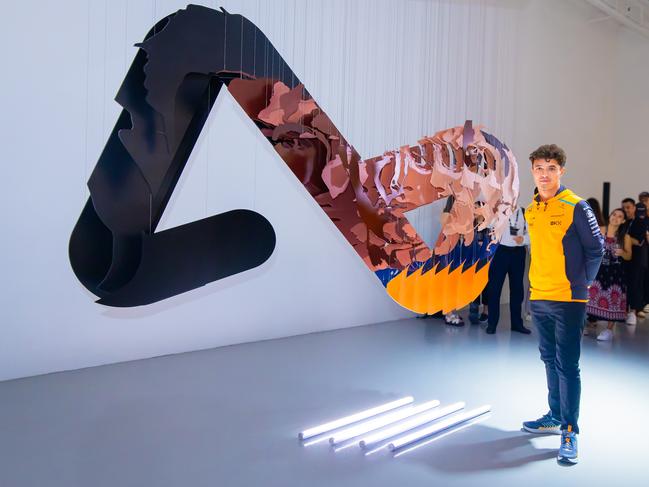 McLaren F1 team driver Lando Norris stands beside the “Shifted Perspectives” 3D sculpture by American artist Michael Murphy 2.jpeg