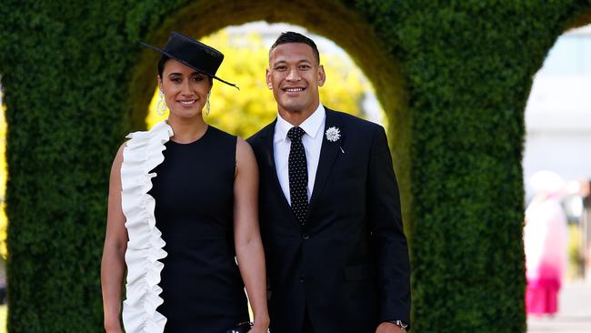 Maria and Israel Folau pose at The Park on AAMI Victoria Derby Day at Flemington.