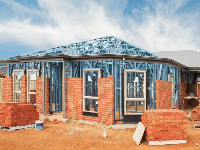 New residential construction home from brick with metal framing against a blue sky; real estate Australian generic suburban homes