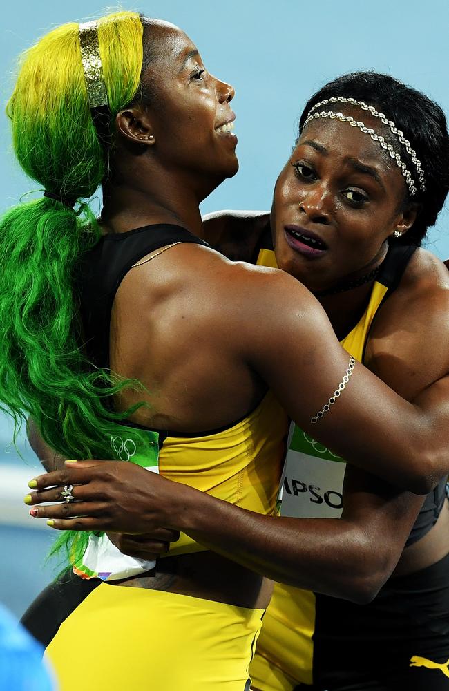 Shelly-Ann Fraser-Pryce congratulates her Jamaican teammate Elaine Thompson.