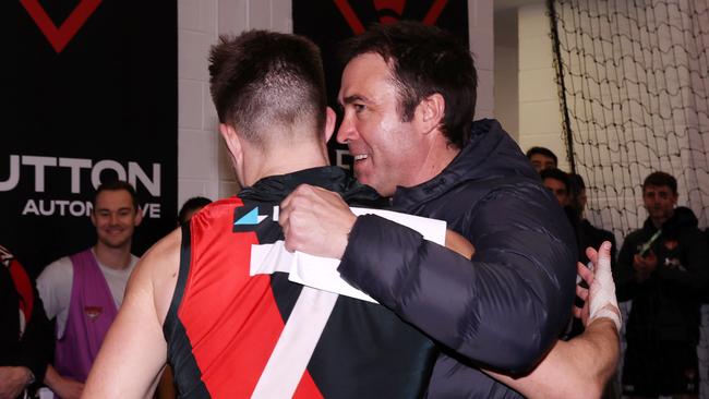 MELBOURNE, AUGUST 4, 2024: 2024 AFL Football - Round 21 - Essendon Bombers V Fremantle Dockers at the MCG. Brad Scott coach of the Bombers celebrates the win with Zach Merrett of the Bombers. Picture: Mark Stewart