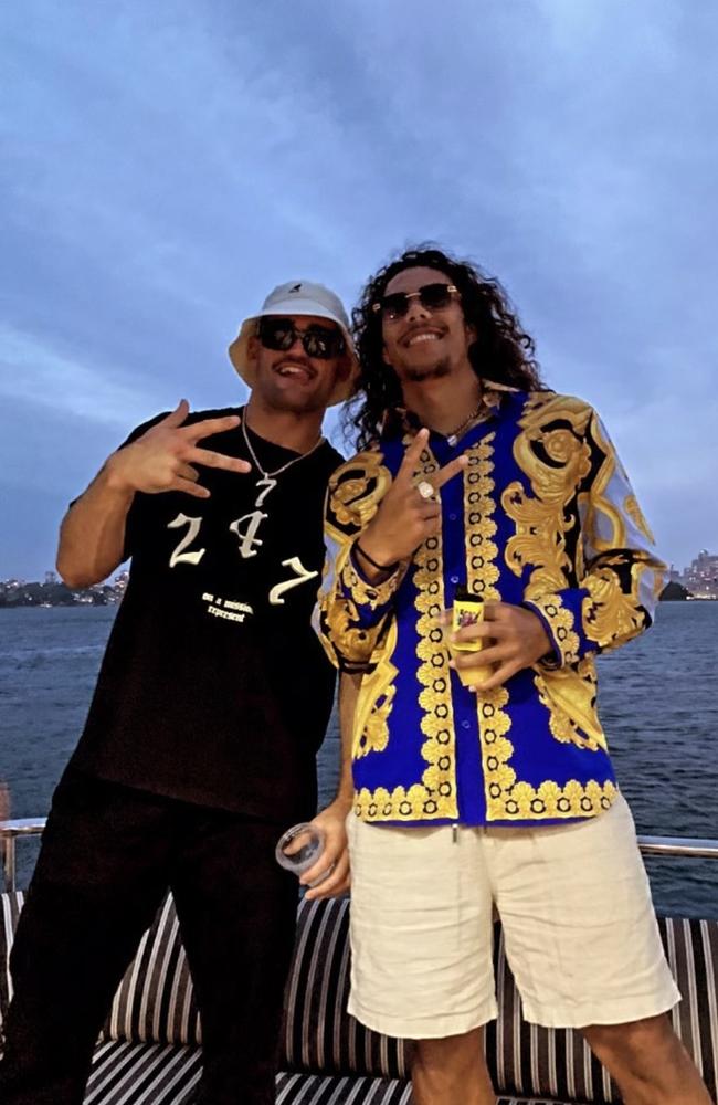 Nathan Cleary and Jarome Luai celebrating on Sydney harbour on Tuesday night.