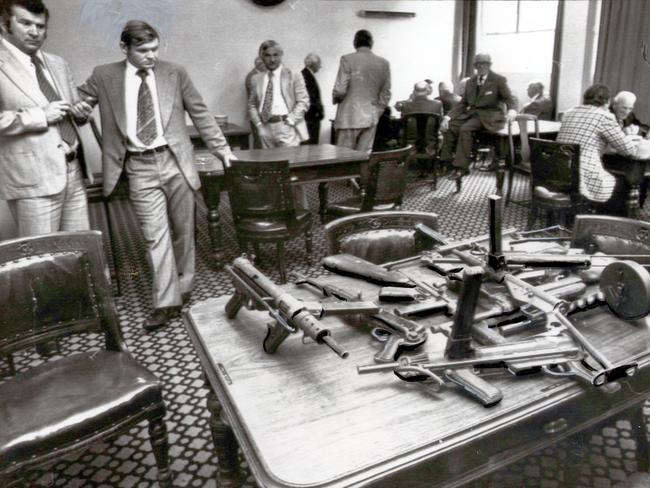 1976: Detectives inside the Victoria Club, Melbourne, display weapons similar to those used during the Great Bookie Robbery in the hope of identifying the culprits. Six armed men raided the Queen St club, with estimates of their haul varying from $1.3 million to $15 million. File picture